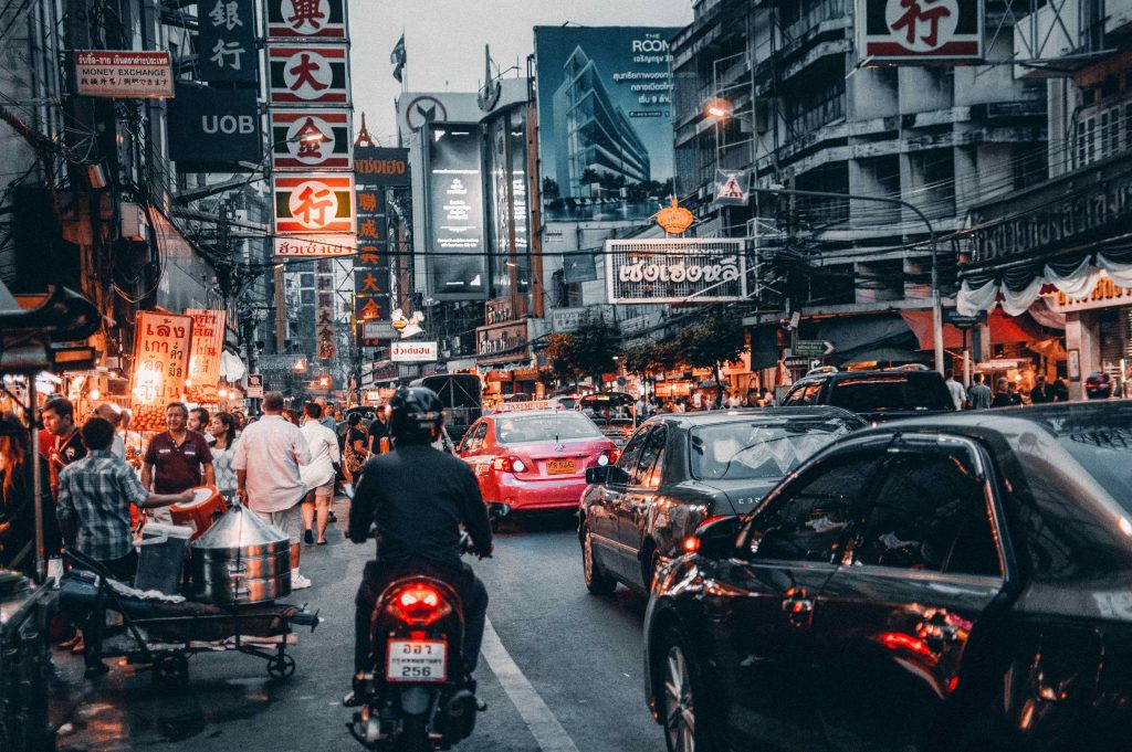 Cars and motorcycle in congested street in Thailand