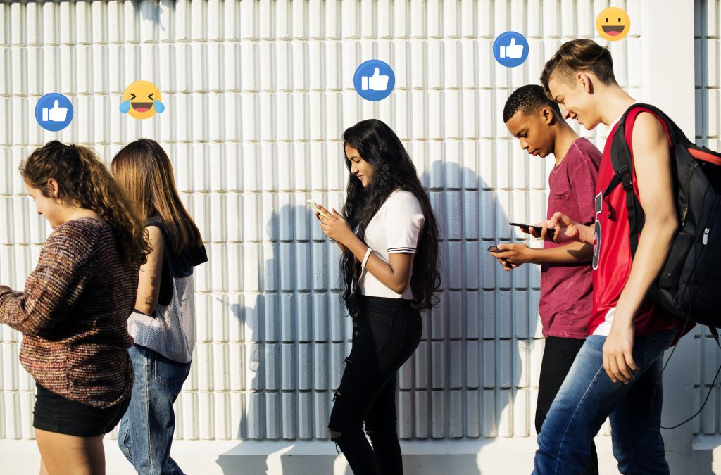 Millennials on social media using smartphone in public